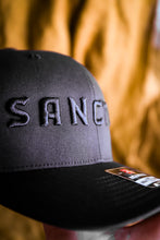 Load image into Gallery viewer, Sanctus Black on Black 3D Puff Trucker Cap